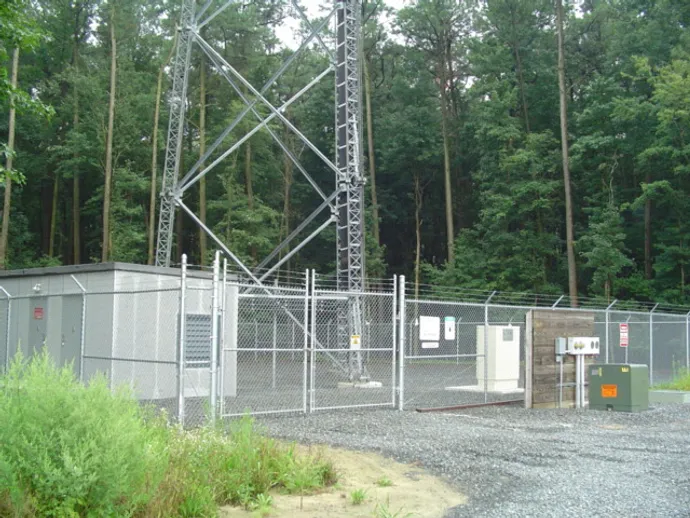 A telecom tower with fences.